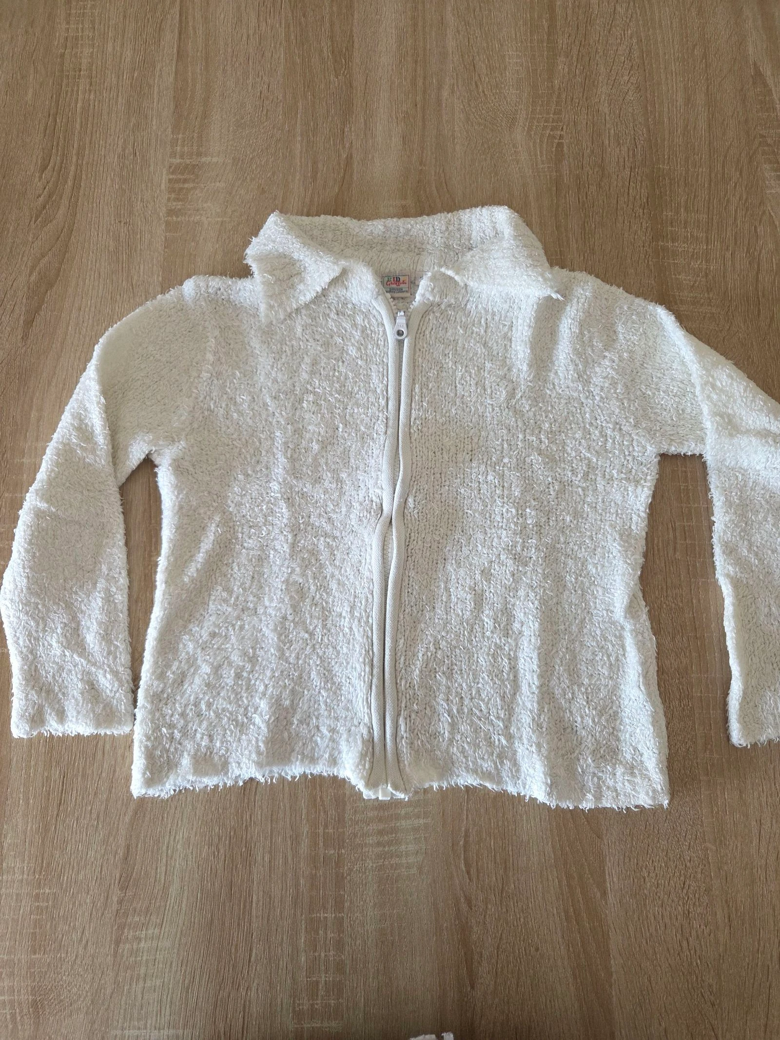 Gilet doux blanc crème taille 10 Kid's graffiti